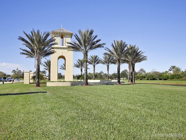 11416 SW Lake Park Dr, Port Saint Lucie, FL 34987 - view of property's community with a lawn