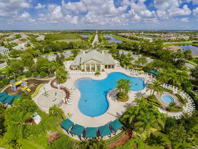 11416 SW Lake Park Dr, Port Saint Lucie, FL 34987 - drone / aerial view of a large body of water and a pool area