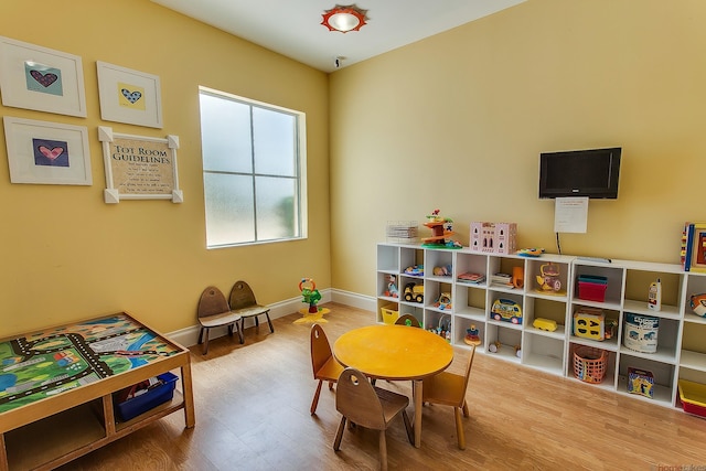 11416 SW Lake Park Dr, Port Saint Lucie, FL 34987 - game room featuring wood finished floors and baseboards