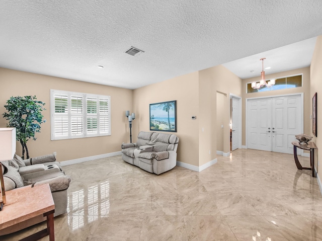 11416 SW Lake Park Dr, Port Saint Lucie, FL 34987 - living room with a chandelier, baseboards, and a textured ceiling