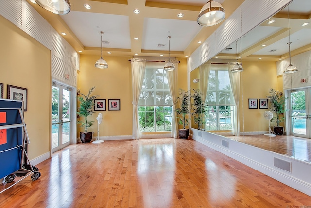 11416 SW Lake Park Dr, Port Saint Lucie, FL 34987 - exercise room featuring wood-type flooring, a high ceiling, plenty of natural light, recessed lighting, and baseboards