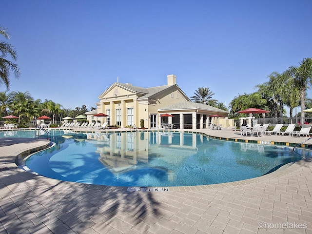11416 SW Lake Park Dr, Port Saint Lucie, FL 34987 - community pool with fence and a patio area