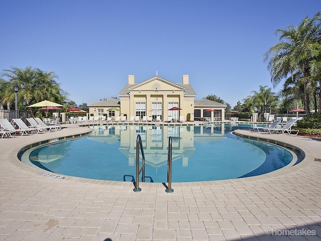11416 SW Lake Park Dr, Port Saint Lucie, FL 34987 - community pool with fence and a patio area