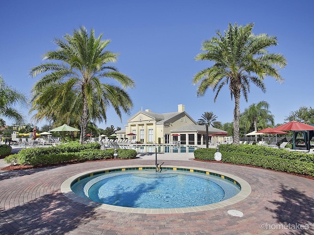 11416 SW Lake Park Dr, Port Saint Lucie, FL 34987 - community pool featuring a community hot tub and fence