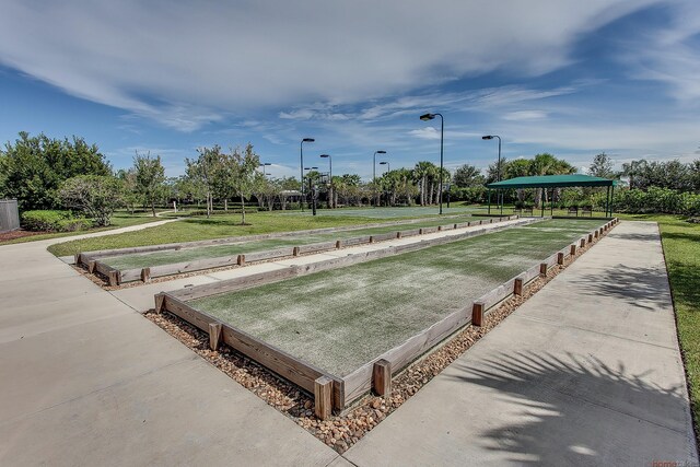 11416 SW Lake Park Dr, Port Saint Lucie, FL 34987 - view of home's community featuring a bocce ball area and a yard