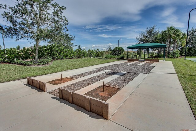 11416 SW Lake Park Dr, Port Saint Lucie, FL 34987 - view of community with a gazebo and a yard