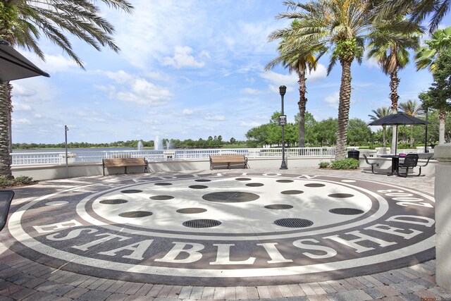 11416 SW Lake Park Dr, Port Saint Lucie, FL 34987 - view of patio featuring a water view