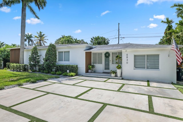 5830 SW 51st Ter, Miami, FL 33155 - ranch-style home with stucco siding, a porch, concrete driveway, and a front yard