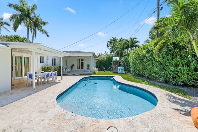 5830 SW 51st Ter, Miami, FL 33155 - view of swimming pool featuring a patio and a playground