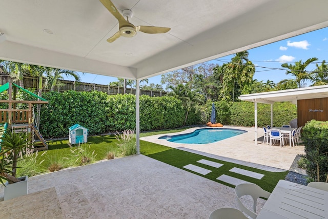 5830 SW 51st Ter, Miami, FL 33155 - view of swimming pool with a patio, a ceiling fan, a playground, and a fenced backyard