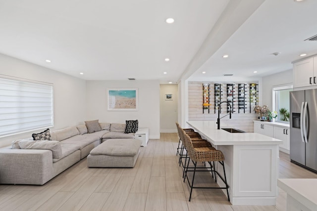 5830 SW 51st Ter, Miami, FL 33155 - living area featuring recessed lighting, light wood finished floors, baseboards, and bar area