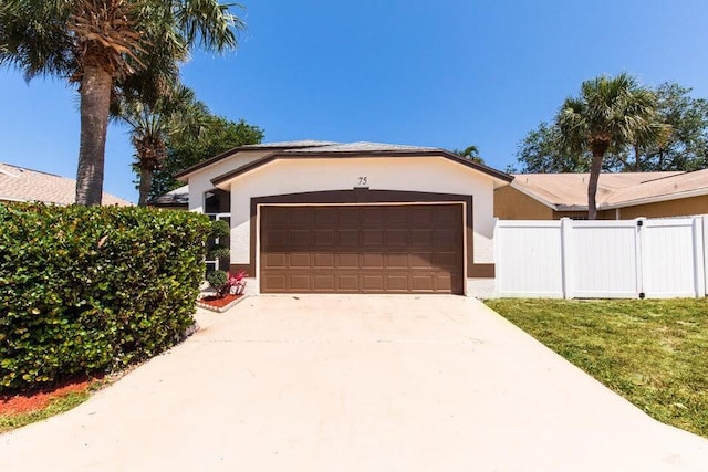 75 Paxford Ln, Boynton Beach, FL 33426 - garage with fence and driveway