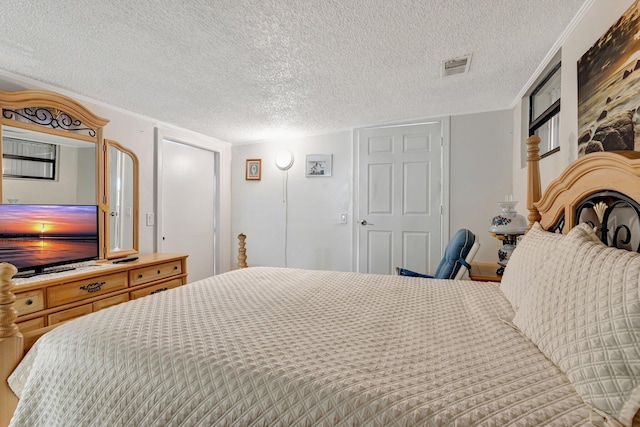 2425 S Florida Mango Rd, West Palm Beach, FL 33406 - bedroom with a textured ceiling and a closet