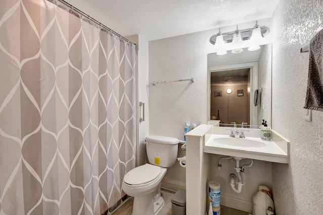 2425 S Florida Mango Rd, West Palm Beach, FL 33406 - full bath featuring a textured wall, a textured ceiling, toilet, a sink, and curtained shower