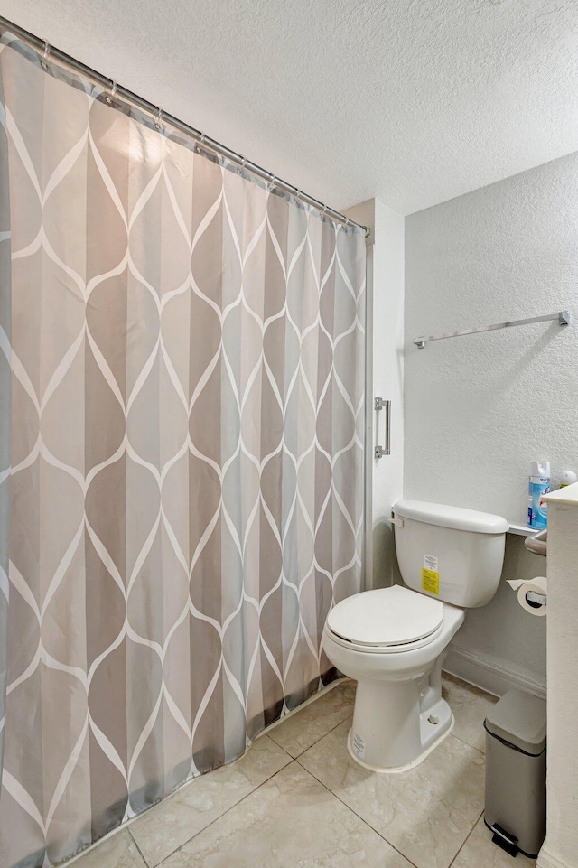 2425 S Florida Mango Rd, West Palm Beach, FL 33406 - bathroom with a textured ceiling, toilet, a textured wall, and a shower with curtain