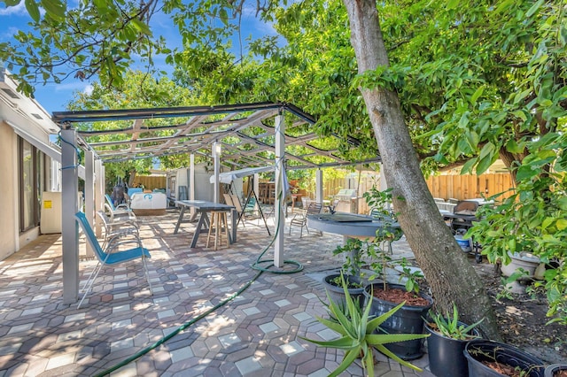 2425 S Florida Mango Rd, West Palm Beach, FL 33406 - view of patio / terrace featuring a fenced backyard, a pergola, a storage unit, and an outdoor structure