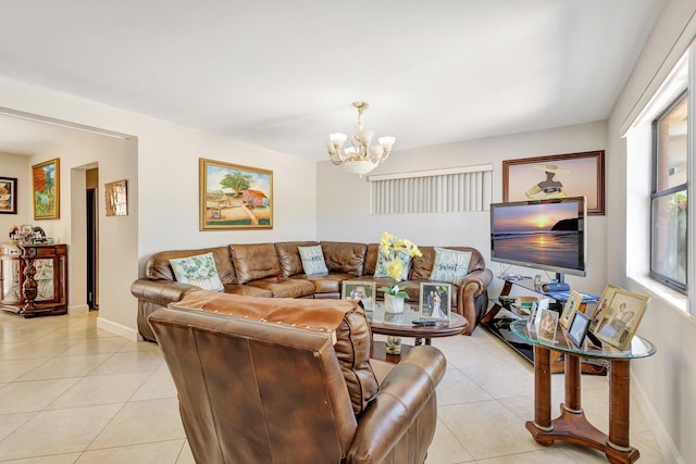 2425 S Florida Mango Rd, West Palm Beach, FL 33406 - living area with light tile patterned floors, a chandelier, and baseboards