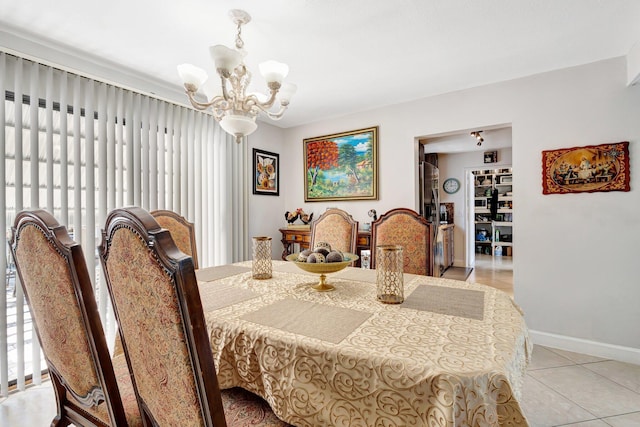 2425 S Florida Mango Rd, West Palm Beach, FL 33406 - dining area featuring a chandelier, light tile patterned floors, and baseboards