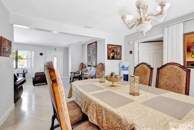 2425 S Florida Mango Rd, West Palm Beach, FL 33406 - dining room featuring light tile patterned flooring, baseboards, and a chandelier