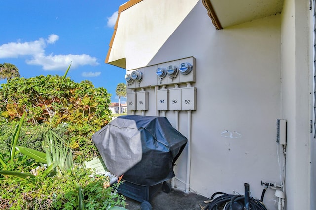 exterior view of mail area, electric meter, and stucco siding