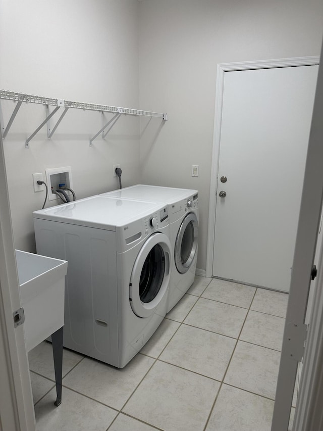 207 Pennock Trace Dr, Jupiter, FL 33458 - washroom with washer and dryer and light tile patterned floors