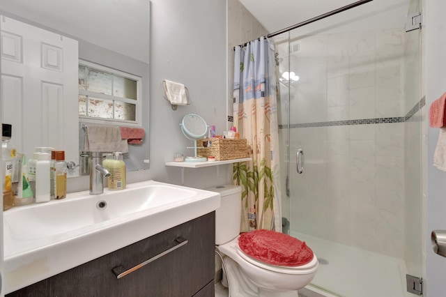 full bathroom featuring a shower stall, toilet, and vanity