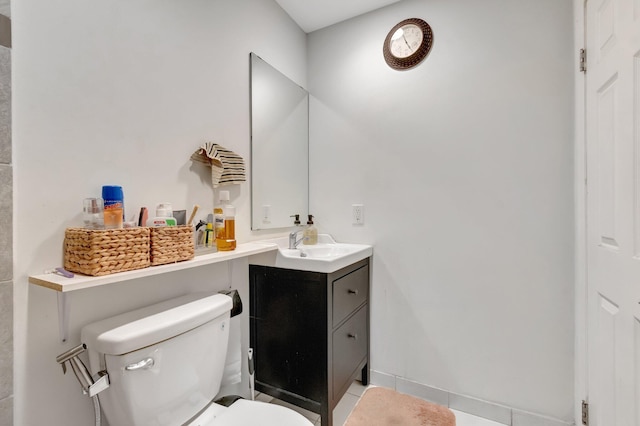 bathroom featuring toilet and vanity