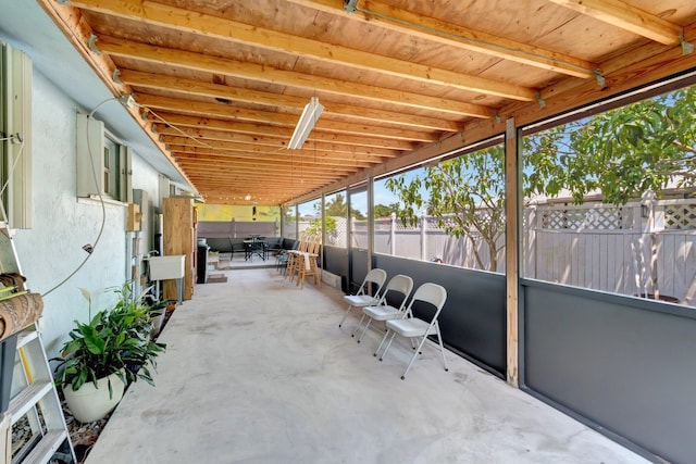 sunroom featuring outdoor dining space