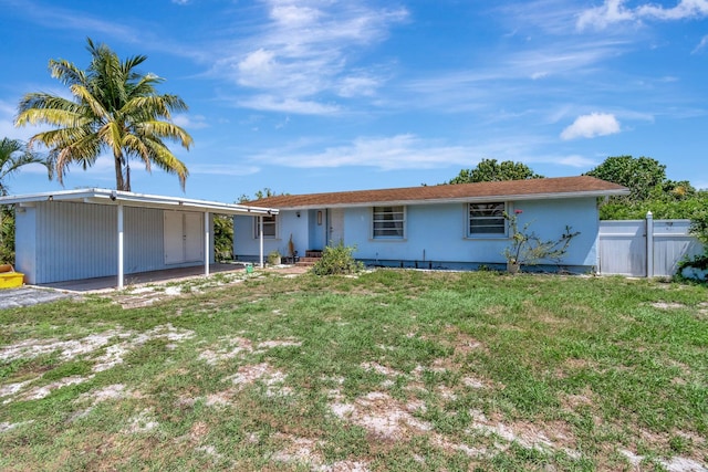 ranch-style home with a carport