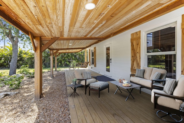 wooden deck featuring outdoor lounge area