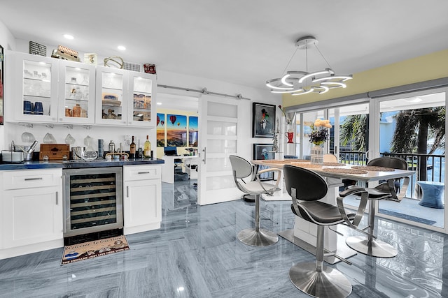 1537 E Hillsboro Blvd Unit 341, Deerfield Beach, FL 33441 - indoor bar with beverage cooler, a barn door, a chandelier, recessed lighting, and pendant lighting