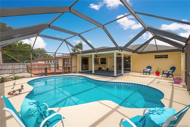 1138 SW Gardena Ave, Port Saint Lucie, FL 34953 - outdoor pool with a patio area, ceiling fan, and glass enclosure