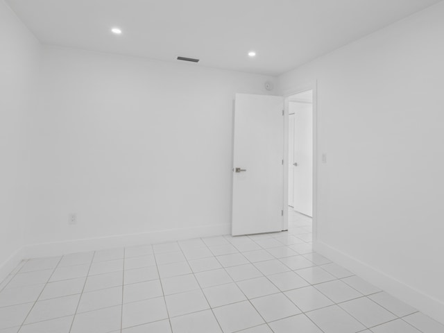 1138 SW Gardena Ave, Port Saint Lucie, FL 34953 - empty room featuring recessed lighting, baseboards, and light tile patterned floors