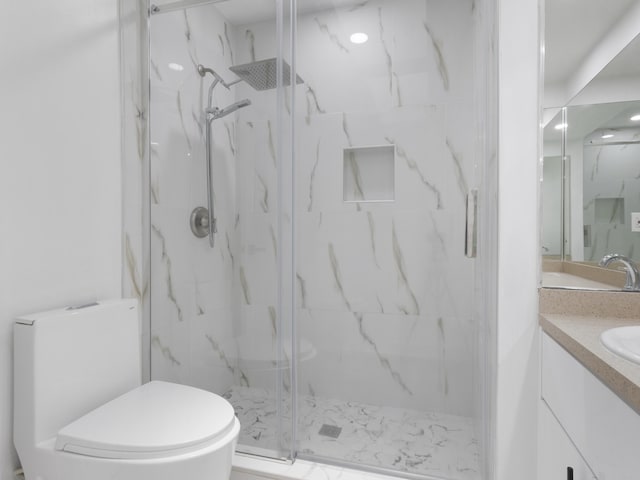 1138 SW Gardena Ave, Port Saint Lucie, FL 34953 - full bathroom featuring a marble finish shower, vanity, and toilet