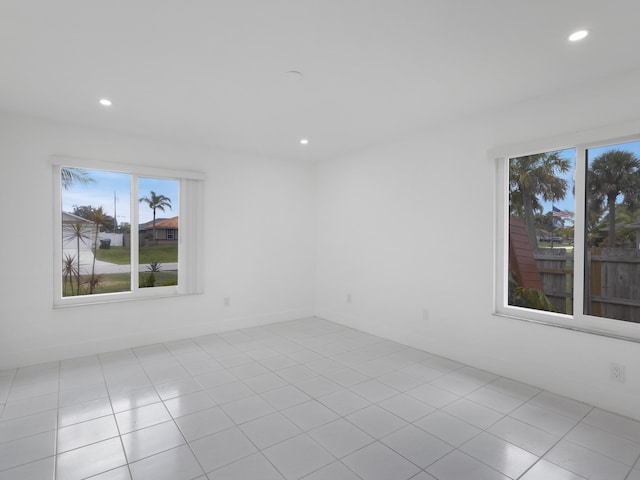 1138 SW Gardena Ave, Port Saint Lucie, FL 34953 - empty room featuring recessed lighting, baseboards, and tile patterned flooring