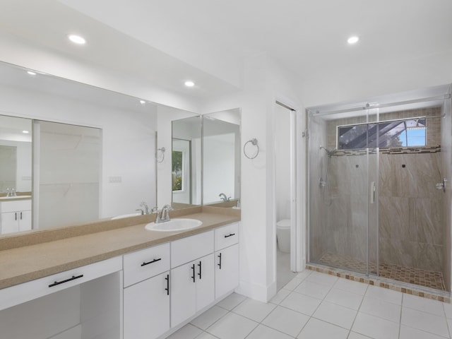 1138 SW Gardena Ave, Port Saint Lucie, FL 34953 - full bath featuring a shower stall, recessed lighting, toilet, vanity, and tile patterned floors