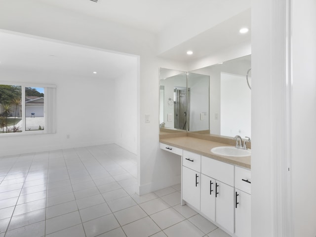 1138 SW Gardena Ave, Port Saint Lucie, FL 34953 - bathroom with tile patterned flooring, vanity, recessed lighting, and baseboards