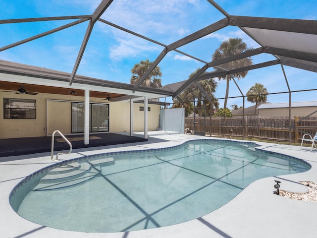 1138 SW Gardena Ave, Port Saint Lucie, FL 34953 - view of swimming pool featuring ceiling fan, a patio, and a lanai