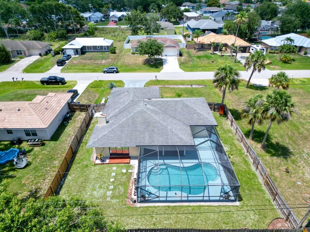 1138 SW Gardena Ave, Port Saint Lucie, FL 34953 - aerial perspective of suburban area featuring a pool