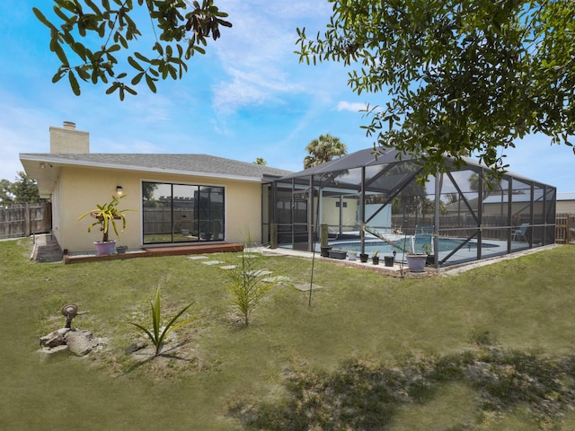 1138 SW Gardena Ave, Port Saint Lucie, FL 34953 - back of house featuring stucco siding and a chimney