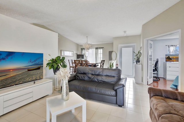 1266 NW 126th Ter, Sunrise, FL 33323 - living area featuring a chandelier, light tile patterned floors, and vaulted ceiling