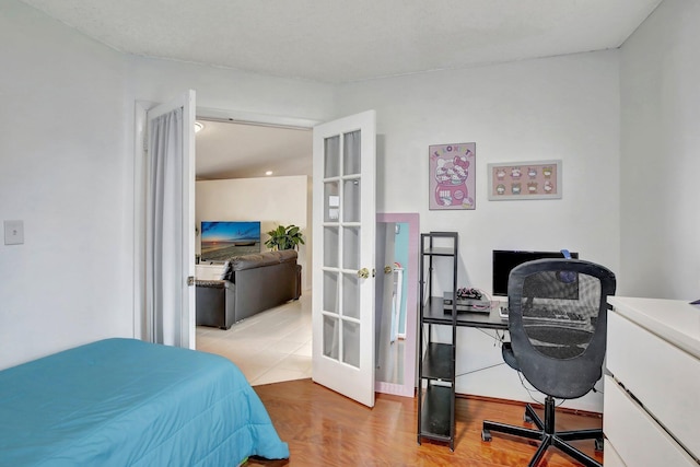 1266 NW 126th Ter, Sunrise, FL 33323 - bedroom with an office area, french doors, and wood finished floors