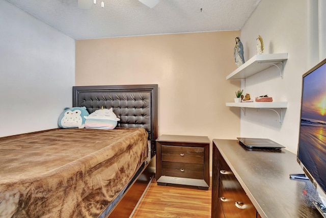 1266 NW 126th Ter, Sunrise, FL 33323 - bedroom featuring light wood finished floors and a textured ceiling