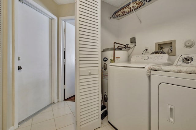 1266 NW 126th Ter, Sunrise, FL 33323 - clothes washing area featuring electric water heater, light tile patterned flooring, and washer and clothes dryer