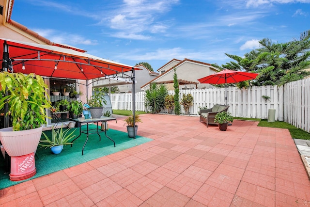 1266 NW 126th Ter, Sunrise, FL 33323 - view of patio / terrace with a gazebo and a fenced backyard