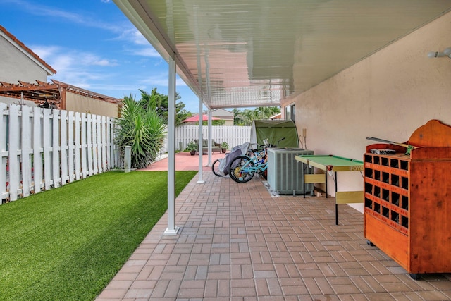 1266 NW 126th Ter, Sunrise, FL 33323 - view of patio / terrace with central AC unit