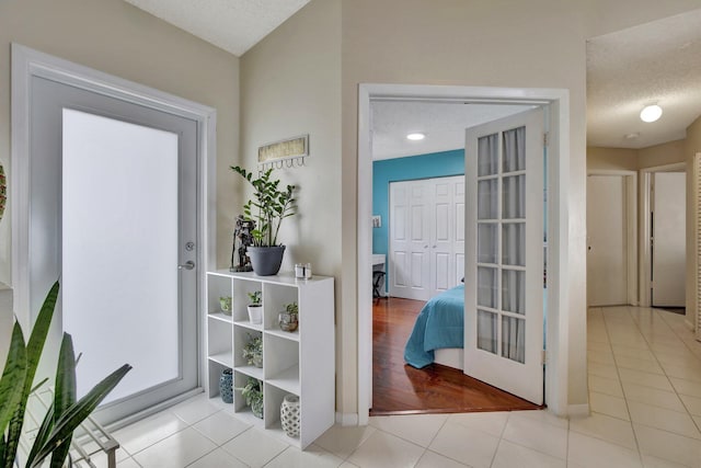 1266 NW 126th Ter, Sunrise, FL 33323 - tiled entrance foyer featuring a textured ceiling and baseboards