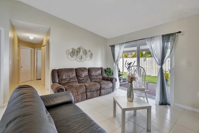 1266 NW 126th Ter, Sunrise, FL 33323 - living area with light tile patterned floors, vaulted ceiling, and baseboards