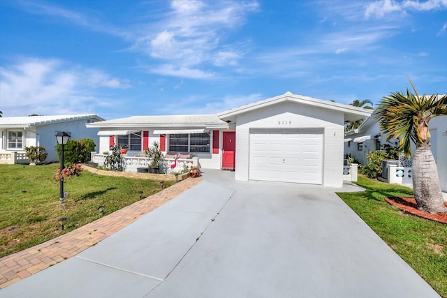 2115 SW 22nd St, Boynton Beach, FL 33426 - ranch-style home with concrete driveway, a garage, and a front lawn