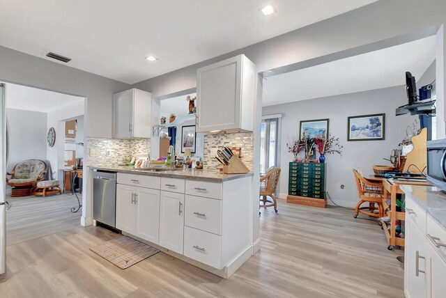 2115 SW 22nd St, Boynton Beach, FL 33426 - kitchen featuring dishwasher, light wood-style floors, a sink, decorative backsplash, and recessed lighting